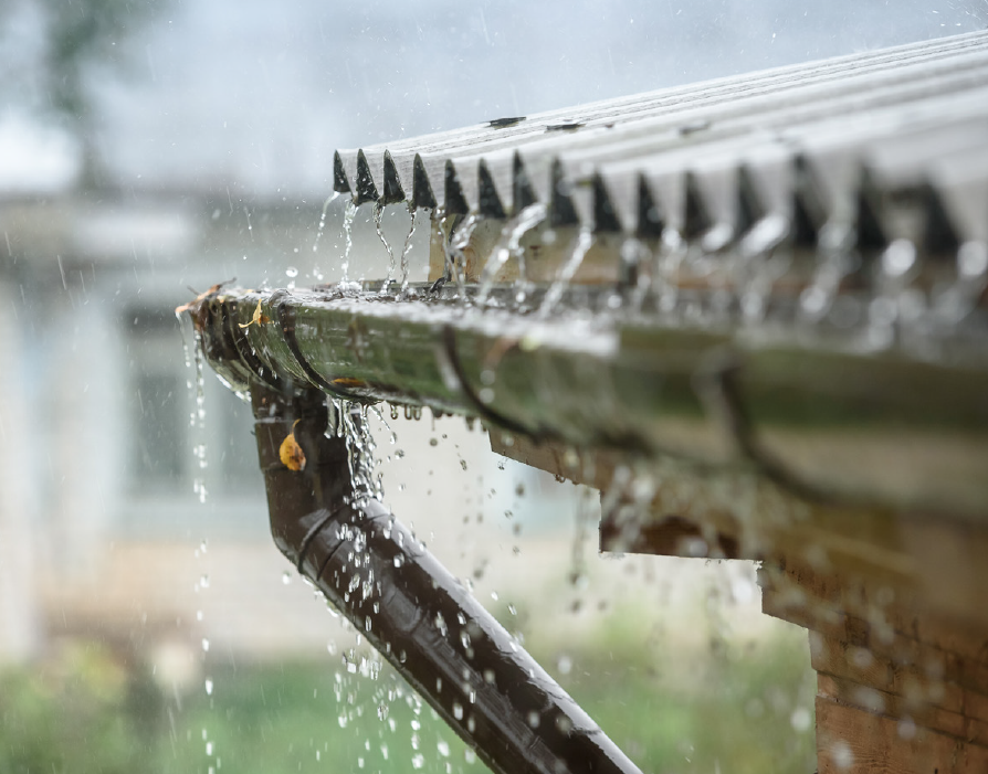 Close-up of roof gutter collecting rainwater during rainfall